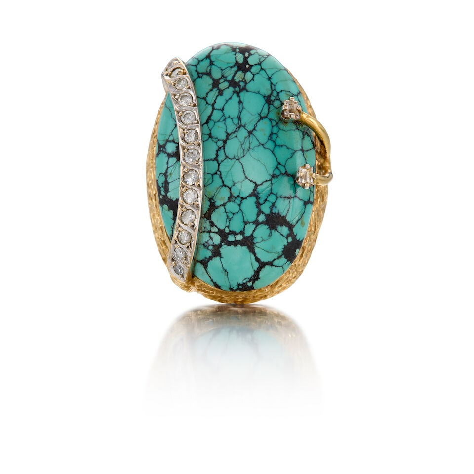 18K BICOLORED GOLD, TURQUOISE, AND DIAMOND RING: 18K BICOLORED GOLD, TURQUOISE, AND DIAMOND RING • One oval cabochon turquoise measuring approximately 34.44mm x 21.92mm x 5.68mm • Thirteen round shaped and two rectangular shaped