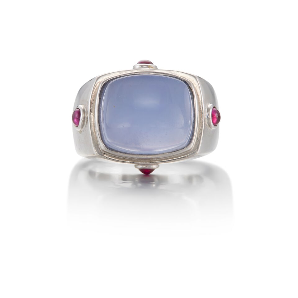 18K WHITE GOLD, CHALCEDONY, AND RUBY RING: 18K WHITE GOLD, CHALCEDONY, AND RUBY RING • One rectangular cabochon chalcedony measuring approximately 14.69mm x 12.64mm x 8.03mm • Four round cabochon rubies measuring approximately