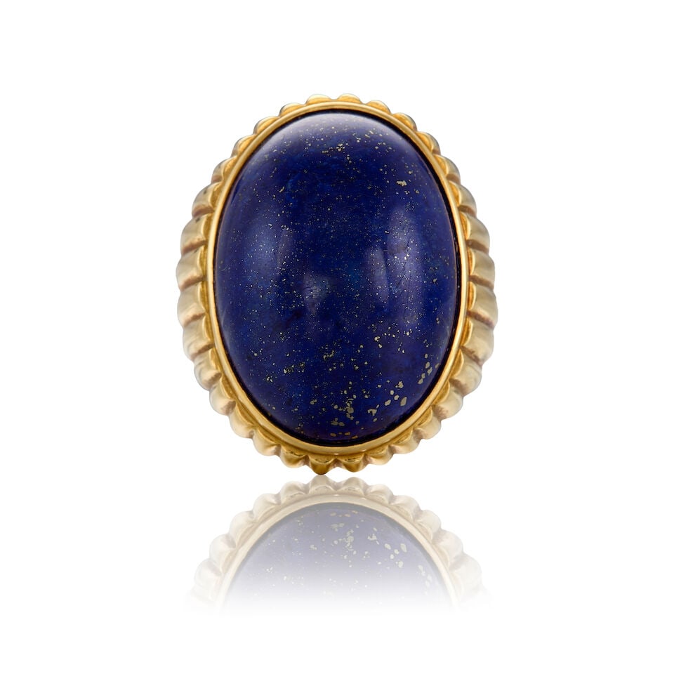 18K YELLOW GOLD AND LAPIS LAZULI RING: 18K YELLOW GOLD AND LAPIS LAZULI RING • One oval cabochon lapis lazuli measuring approximately 24.29mm x 17.91mm x 8.60mm • Size 7 1/4 • Estimated gross weight: 17.3