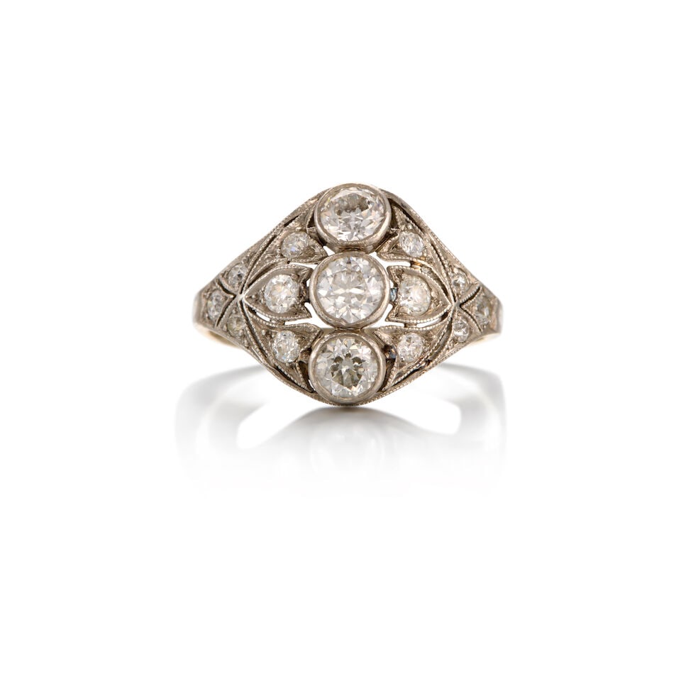 PLATINUM, 14K WHITE GOLD AND DIAMOND RING: PLATINUM, 14K WHITE GOLD AND DIAMOND RING • Fifteen round-shaped diamonds weighing approximately 1.25 carats total • Size 7 • Estimated gross weight 3.80 grams Footnotes: OVERALL