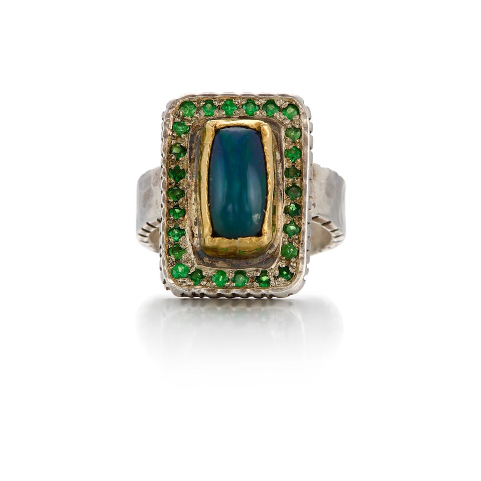 A GOLD, STERLING SILVER, OPAL AND TSAVORITE RING: A GOLD, STERLING SILVER, OPAL AND TSAVORITE RING • 20K yellow gold and sterling silver • One rectangular-shaped opal measuring approximately 11.12mm x 5.53mm x dept isn't available due to