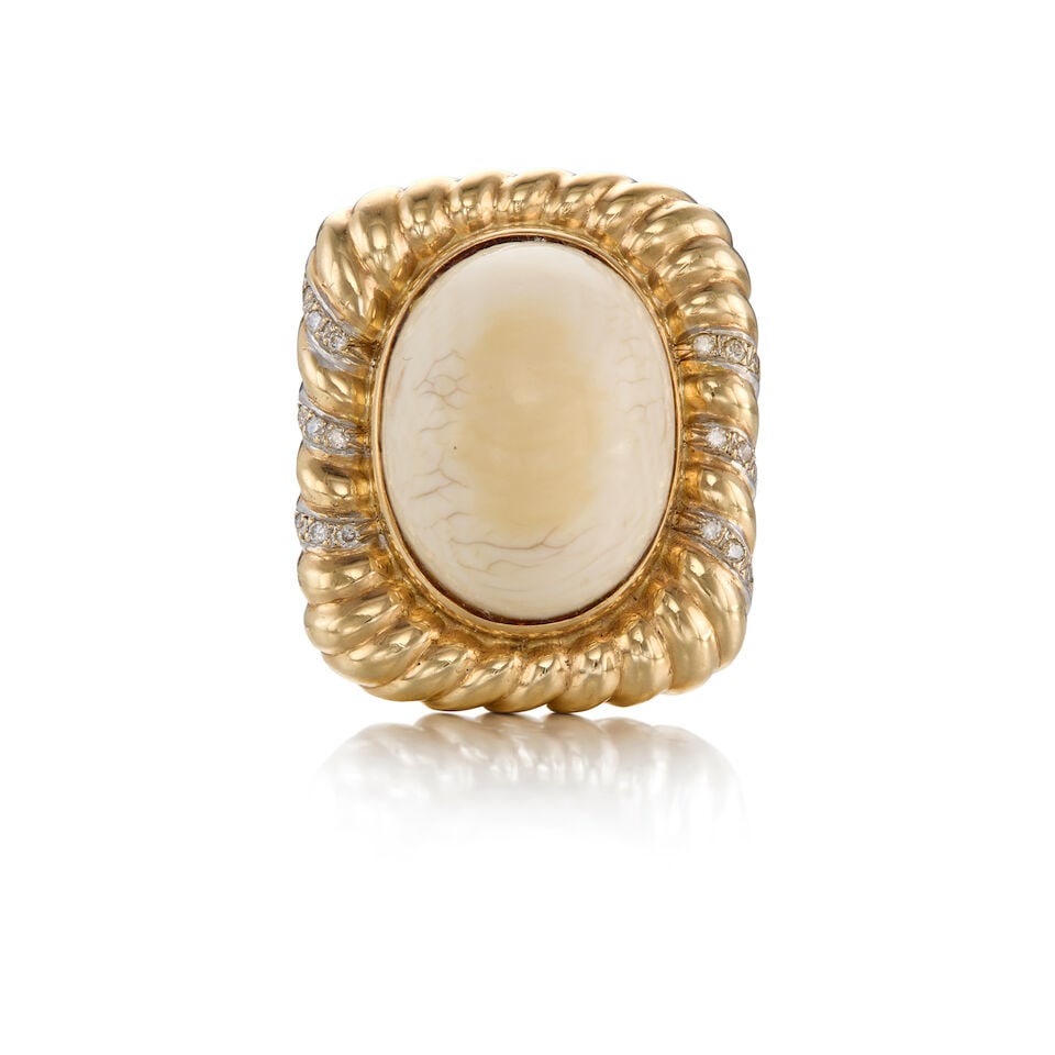 14K YELLOW GOLD, CORAL, AND DIAMOND RING: 14K YELLOW GOLD, CORAL, AND DIAMOND RING • An oval cabochon coral measuring approximately 20.46mm x 15.71mm x 10.07mm • Eighteen round shaped melee diamonds • Head of the ring measur