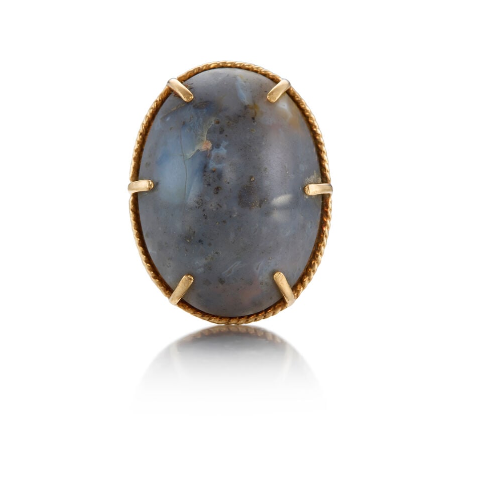 10K GOLD AND CHALCEDONY RING: 10K GOLD AND CHALCEDONY RING • One oval cabochon chalcedony weighing approximately 33.80 carats • Size 8 • Estimated gross weight: 12.30 grams Footnotes: OVERALL CONDITION: