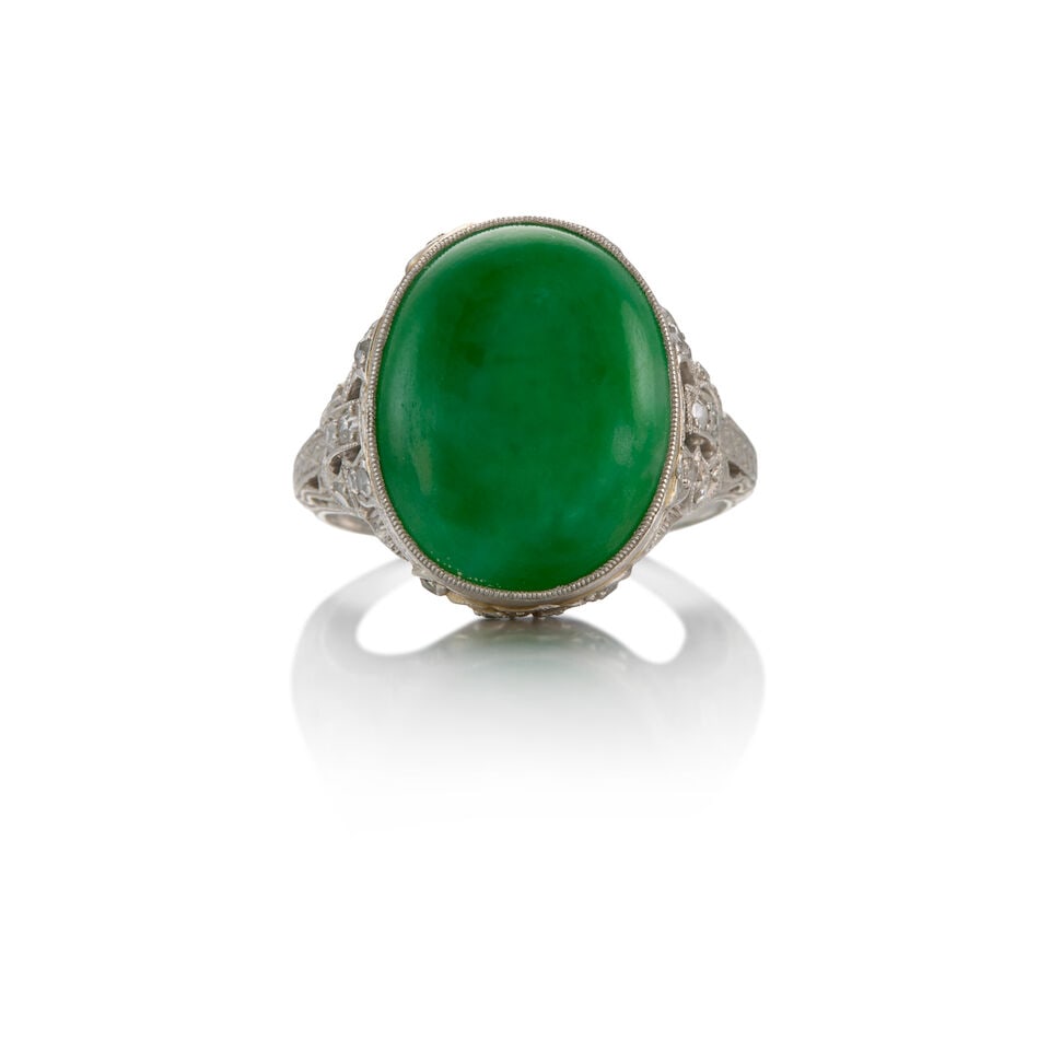 WALTON: PLATINUM, JADE AND DIAMOND RING: WALTON: PLATINUM, JADE AND DIAMOND RING • One oval cabochon-shaped jade weighing approximately 6.13 carats • Thirty-six round single-cut diamonds weighing approximately 0.54 carat total &#