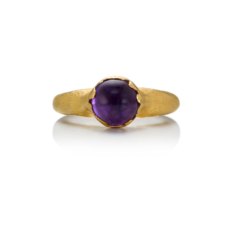 22K GOLD AND AMETHYST RING: 22K GOLD AND AMETHYST RING • One round cabochon-shaped amethyst measuring approximately 8.05mm in diameter • Maker's mark present • Size 6 3/4 • Estimated gross weight: 4.80 gr
