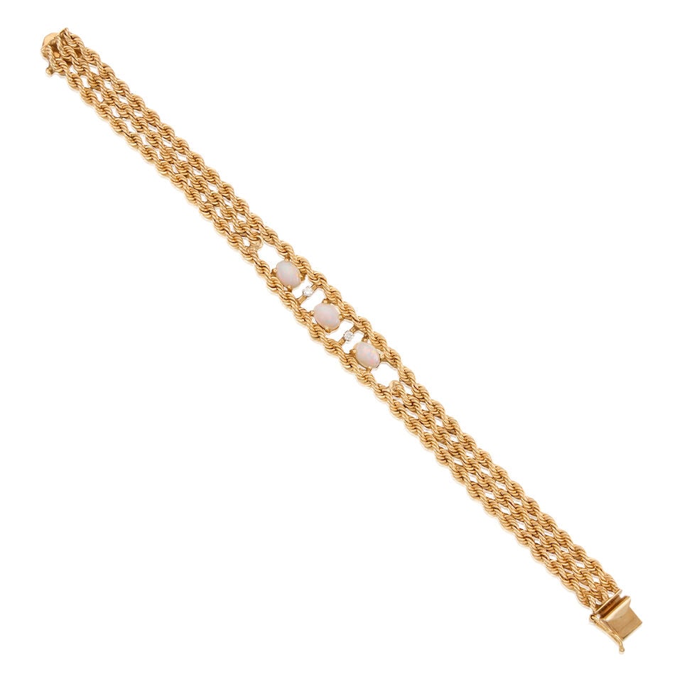 13K GOLD, OPAL AND DIAMOND BRACELET: 13K GOLD, OPAL AND DIAMOND BRACELET • Three oval-shaped opals weighing approximately 1.56 carats total • Two round brilliant-cut diamonds weighing approximately 0.08 carat total •
