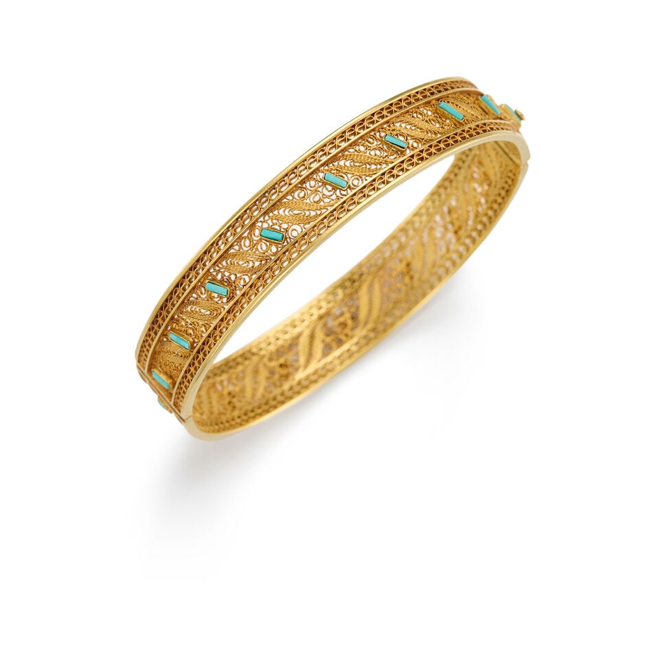 14K GOLD AND TURQUOISE BANGLE BRACELET: 14K GOLD AND TURQUOISE BANGLE BRACELET • 14K gold bangle bracelet with safety chain • Seventeen rectangular-shaped turquoises measuring approximately 3.21mm x 1.07mm • Inner