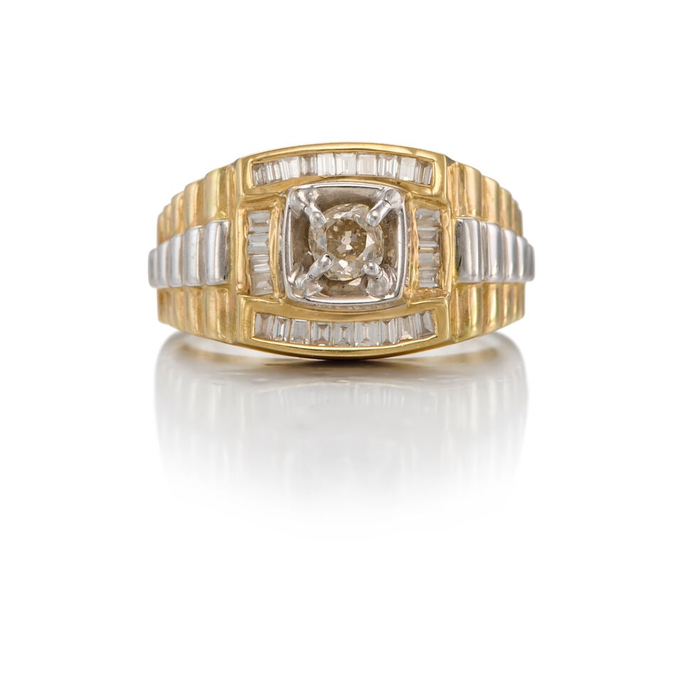 BICOLORED GOLD AND DIAMOND RING: BICOLORED GOLD AND DIAMOND RING • 12K, 14K yellow gold and white gold • One old mine-cut diamond weighing approximately 0.39 carat total • Numerous baguette-shaped diamonds weighing 