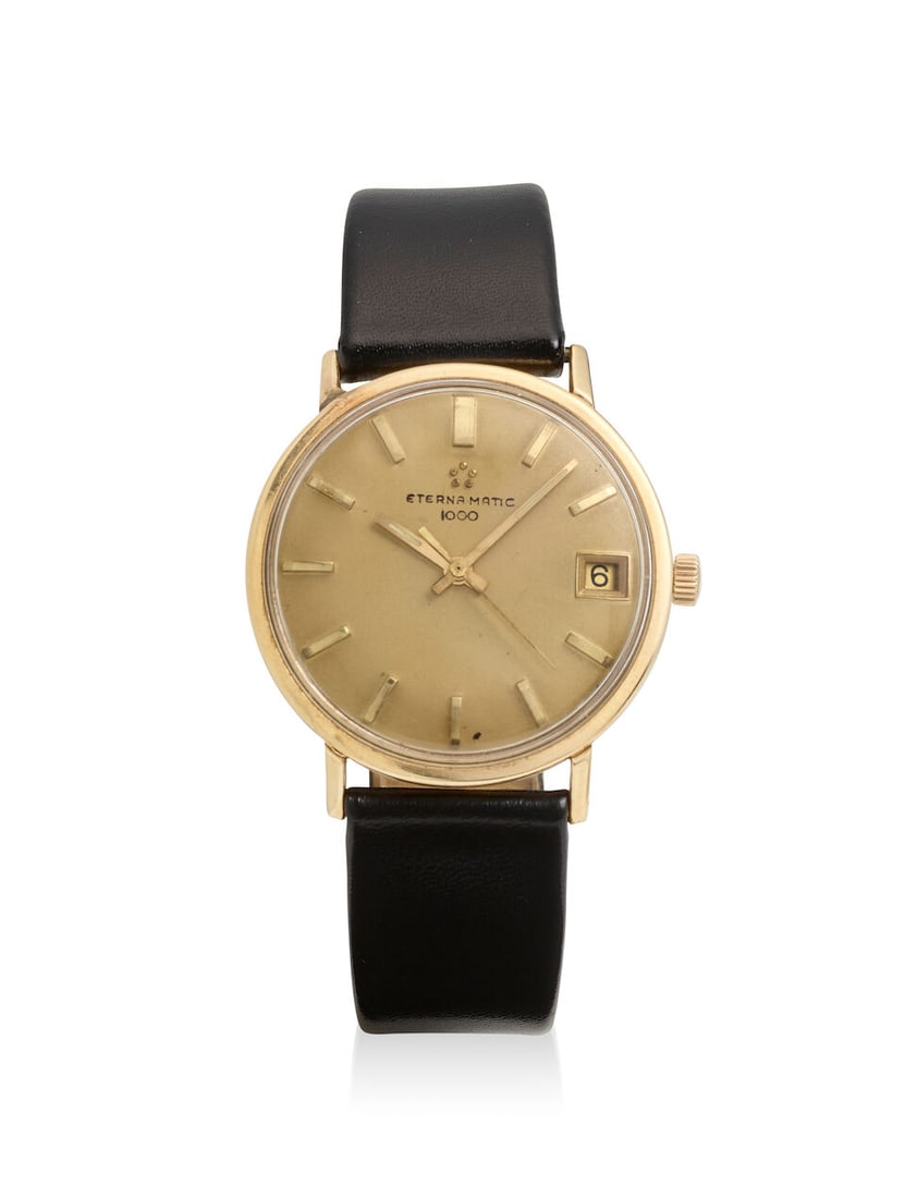 ETERNA: 14K GOLD AND GOLD PLATED CALENDAR WRISTWATCH: ETERNA: 14K GOLD AND GOLD PLATED CALENDAR WRISTWATCH • 14K yellow gold watch case and leather strap with mixed metal gold plated clasp • Signed ETERNA MATIC 1000 on the dial • Automa