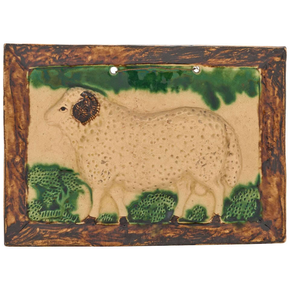 A Scottish Creamware Plaque of a Ram, early 19th century,: A Scottish Creamware Plaque of a Ram, early 19th century, self-framed and decorated in translucent brown and green oxides, ht. 8, wd. 11 1/2 in. For further information on this lot please visit