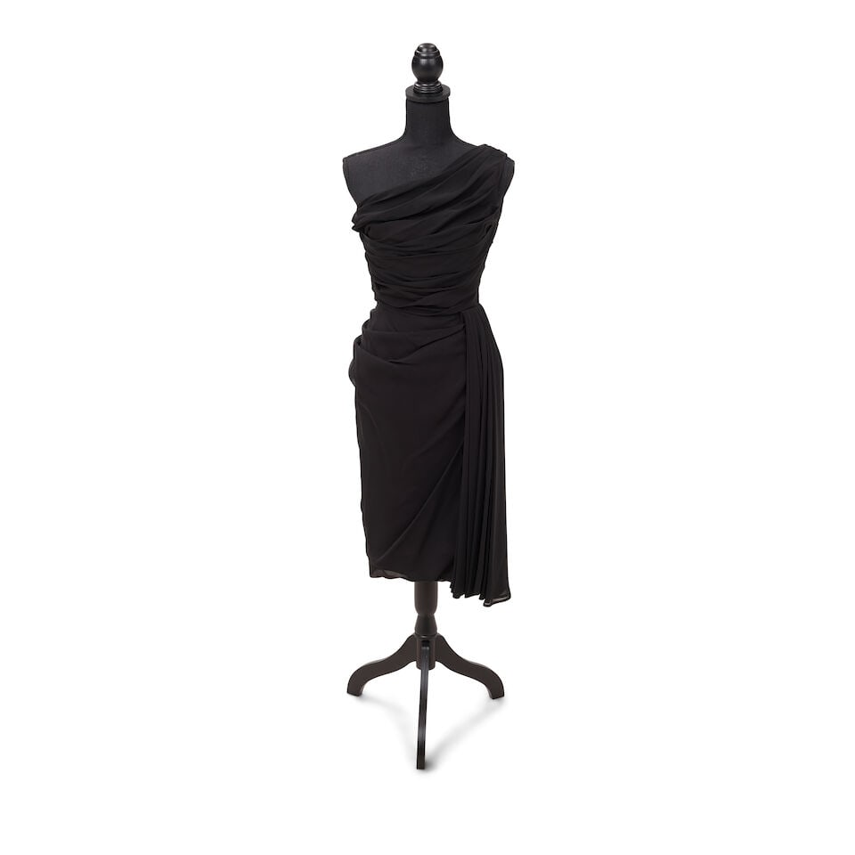 TWO BLACK DRESS LOOKS Late 1980s: TWO BLACK DRESS LOOKS Late 1980s First look: Cyndi Lauper's mother's one-shoulder dress; Second look: a Francine Lee black ruffle dress, and a black blazer, shoulders 16 1/4in; together with a