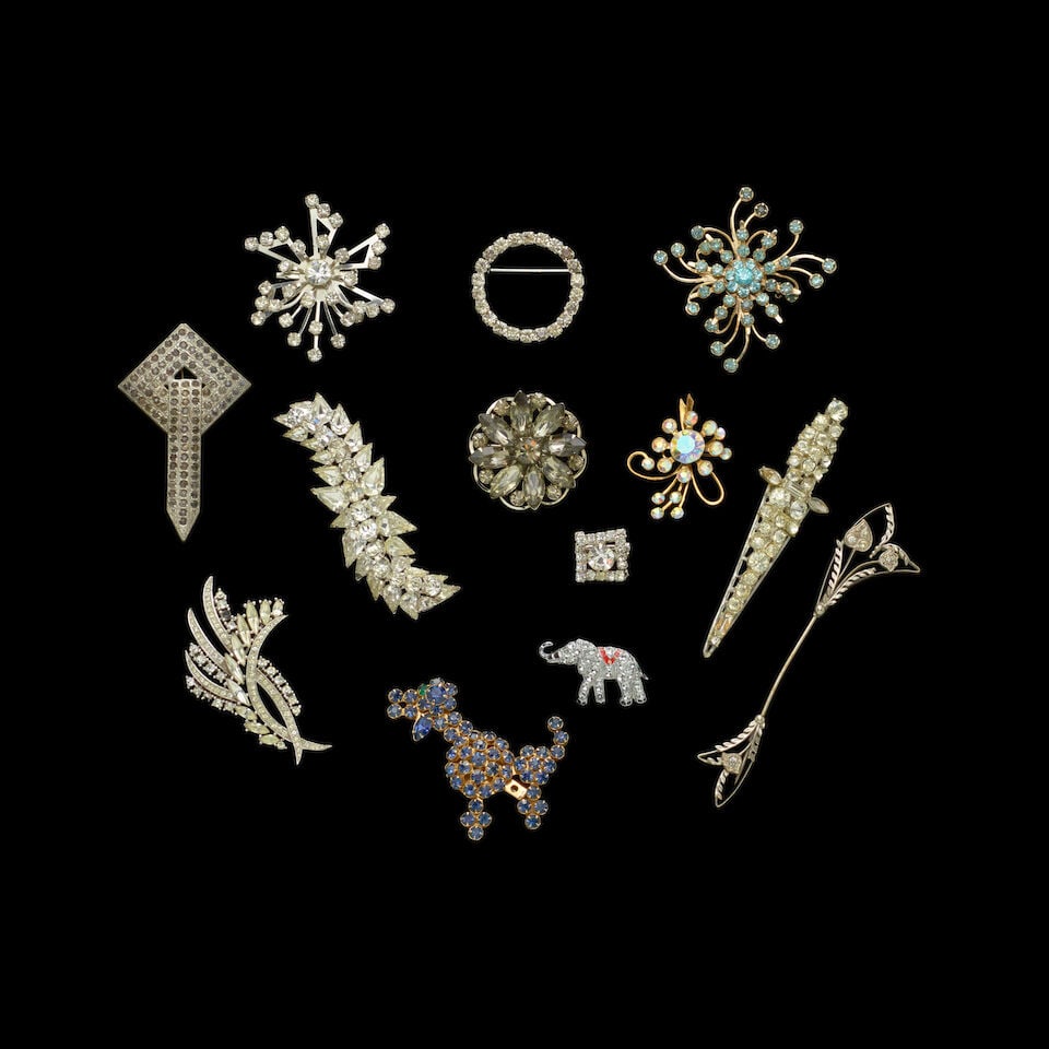 A GROUP OF STAGE-WORN VINTAGE RHINESTONE PINS 1980s - 2