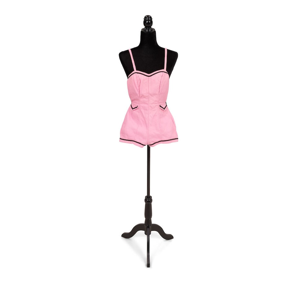 TWO BATHING COSTUMES AND A PLAID BLAZER LOOK Early 1980s: TWO BATHING COSTUMES AND A PLAID BLAZER LOOK Early 1980s First look: a red and gray plaid blazer, a pink and nude corselette, a gray skirt with red and pink ribbons, a Schapiro's gray cummerbund, and