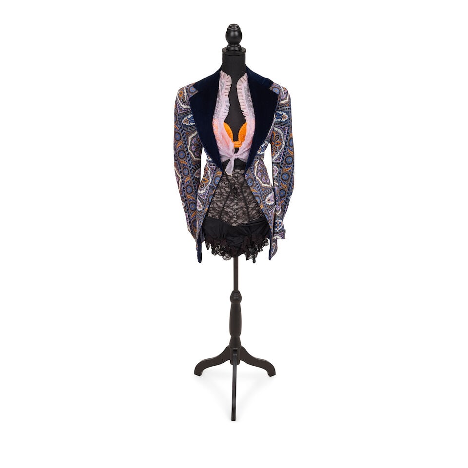 TWO LAYERED LOOKS 1980s, styled by Cyndi Lauper: TWO LAYERED LOOKS 1980s, styled by Cyndi Lauper First look: a sheer white blouse, a white lace and black satin black bustier, a mixed material applique skirt, a black girdle, a faux black leather