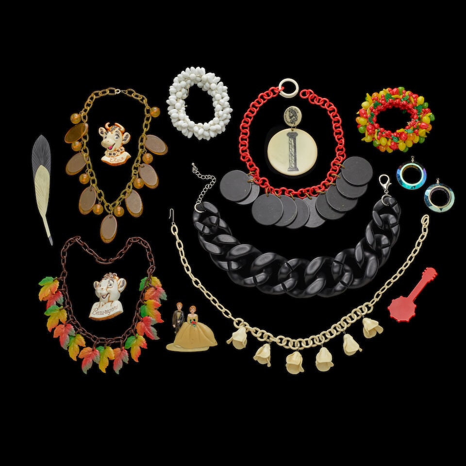 A GROUP OF STAGE-WORN VINTAGE BAKELITE, CELLULOID, AND PLASTIC JEWELRY 1980s (1 of 2)