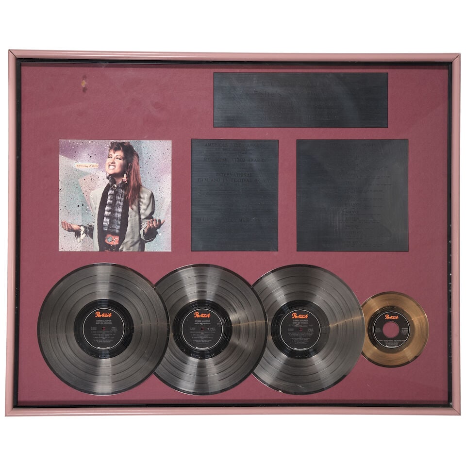 FIVE GOLD AND PLATINUM IN-HOUSE AND RIAA AWARDS FOR SHE'S SO UNUSUAL PRESENTED TO CYNDI LAUPER (1 of 5)