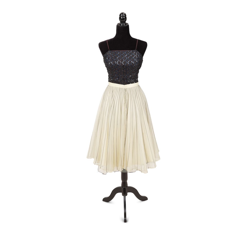 A GROUP OF BLUE ANGEL PROMOTIONAL PHOTOSHOOT LOOKS Early 1980s: A GROUP OF BLUE ANGEL PROMOTIONAL PHOTOSHOOT LOOKS Early 1980s Comprising a floral embellished yellow dress, a black sequin romper with a Rene Ricky black and white striped and pleated tulle and