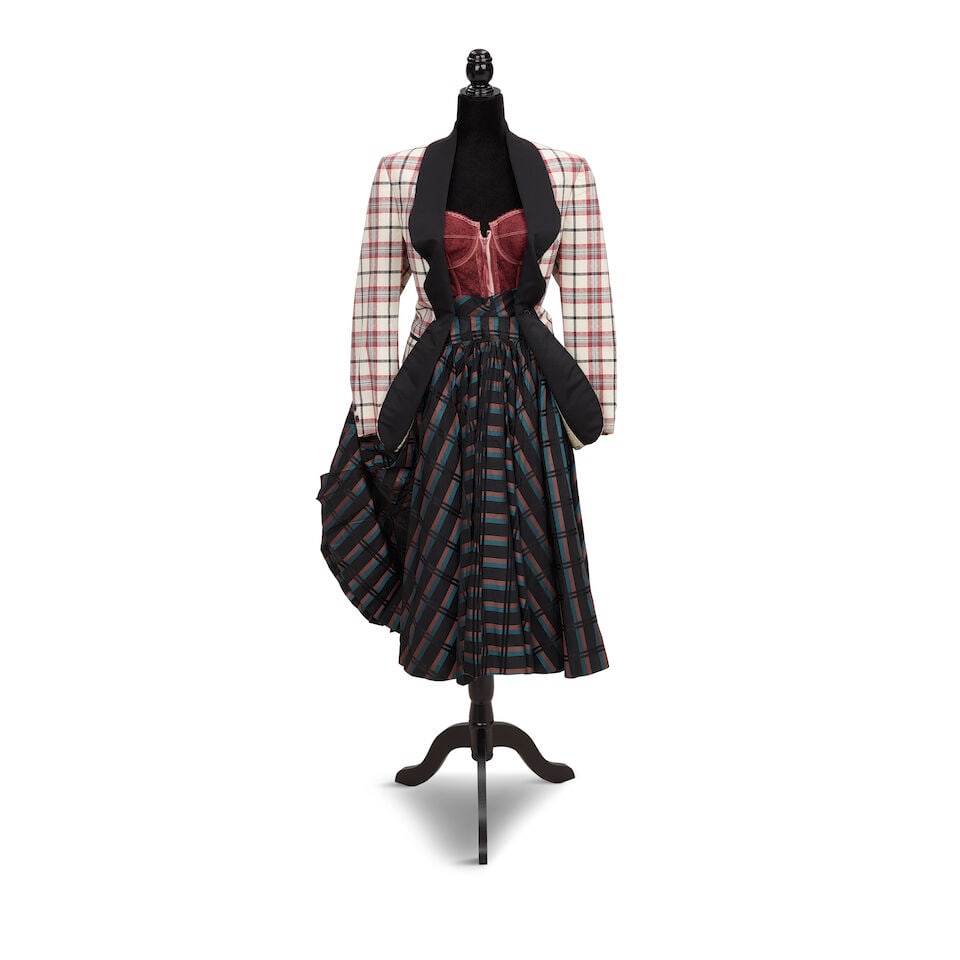 TWO STAGE-WORN BLAZER AND SKIRT LOOKS Mid-1980s, styled by Cyndi Lauper: TWO STAGE-WORN BLAZER AND SKIRT LOOKS Mid-1980s, styled by Cyndi Lauper First look: a striped yellow blazer, a black lace guêpière, and an orange, yellow, black, and white striped skirt;