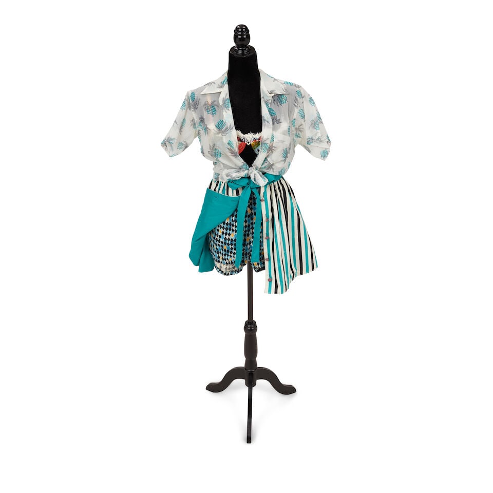 A GROUP OF TROPICAL LOOKS Early 1980s, styled by Cyndi Lauper: A GROUP OF TROPICAL LOOKS Early 1980s, styled by Cyndi Lauper First look: a Dupont sheer tropical print button-up blouse, 8, a Brass fringed tropical print bikini top, 40, a buttoned teal, black, and 