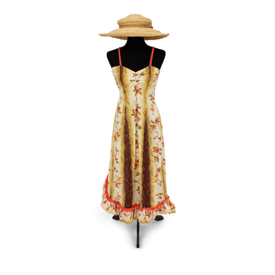 TWO VINTAGE TROPICAL LOOKS 1980s, styled by Cyndi Lauper: TWO VINTAGE TROPICAL LOOKS 1980s, styled by Cyndi Lauper First look: a Watumull's yellow, purple, and green patterned button-up shirt, a purple patterned bathing costume, a Wembley blue, red, and a wh