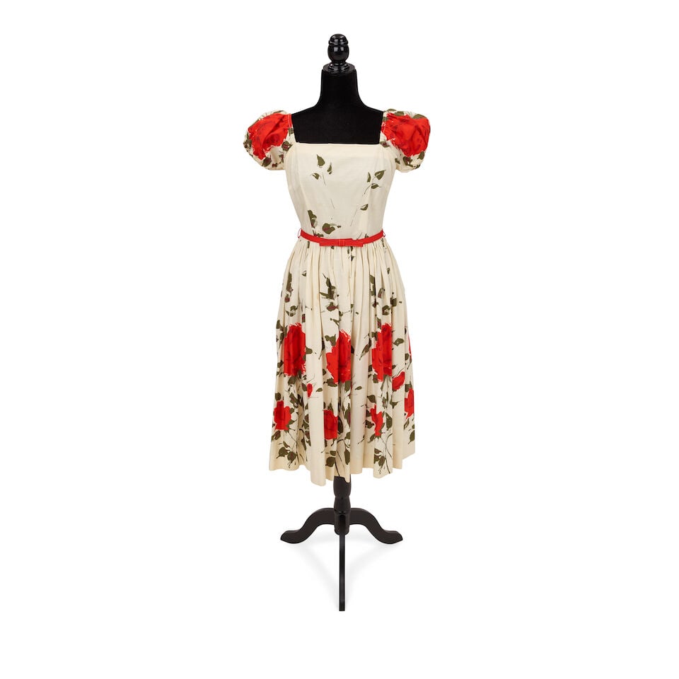 A GROUP OF VINTAGE DRESSES 1980s: A GROUP OF VINTAGE DRESSES 1980s Comprising a white, red, and black floral dress, a green and blue floral dress, a red, blue, and white sheer floral dress, a red and white sheer dress, and three house