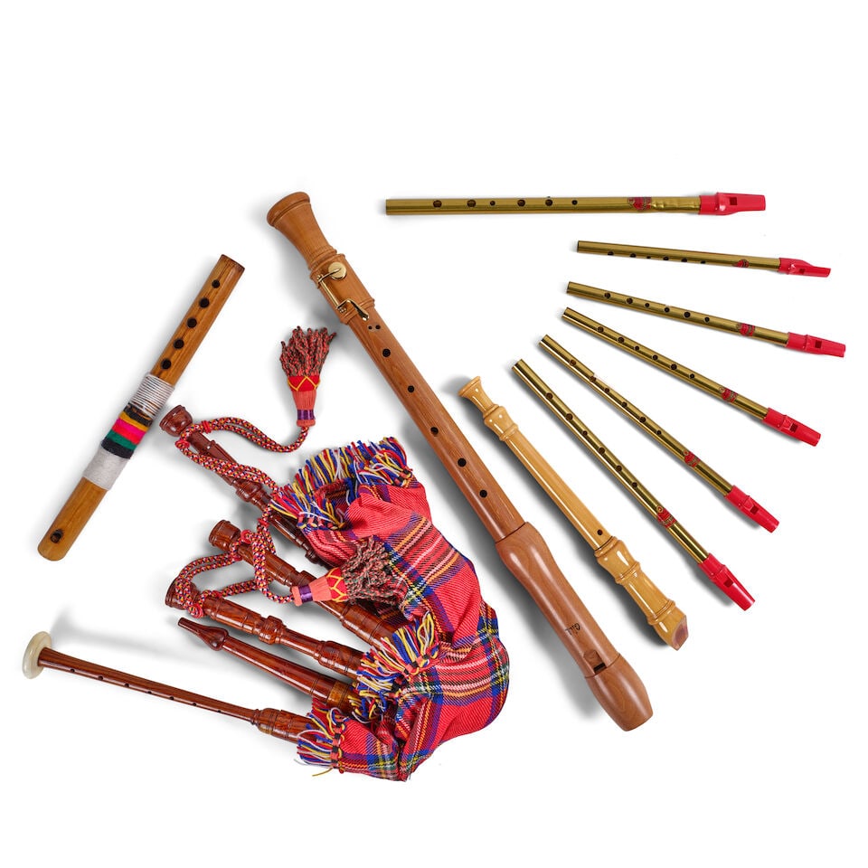 A GROUP OF MUSICAL INSTRUMENTS: A GROUP OF MUSICAL INSTRUMENTS Comprising a set of red tartan bagpipes, six Generation tin whistles, in various keys, a Gill wood recorder, a bamboo flute, and a Hohner Blockfloite, C-Sopran Solo