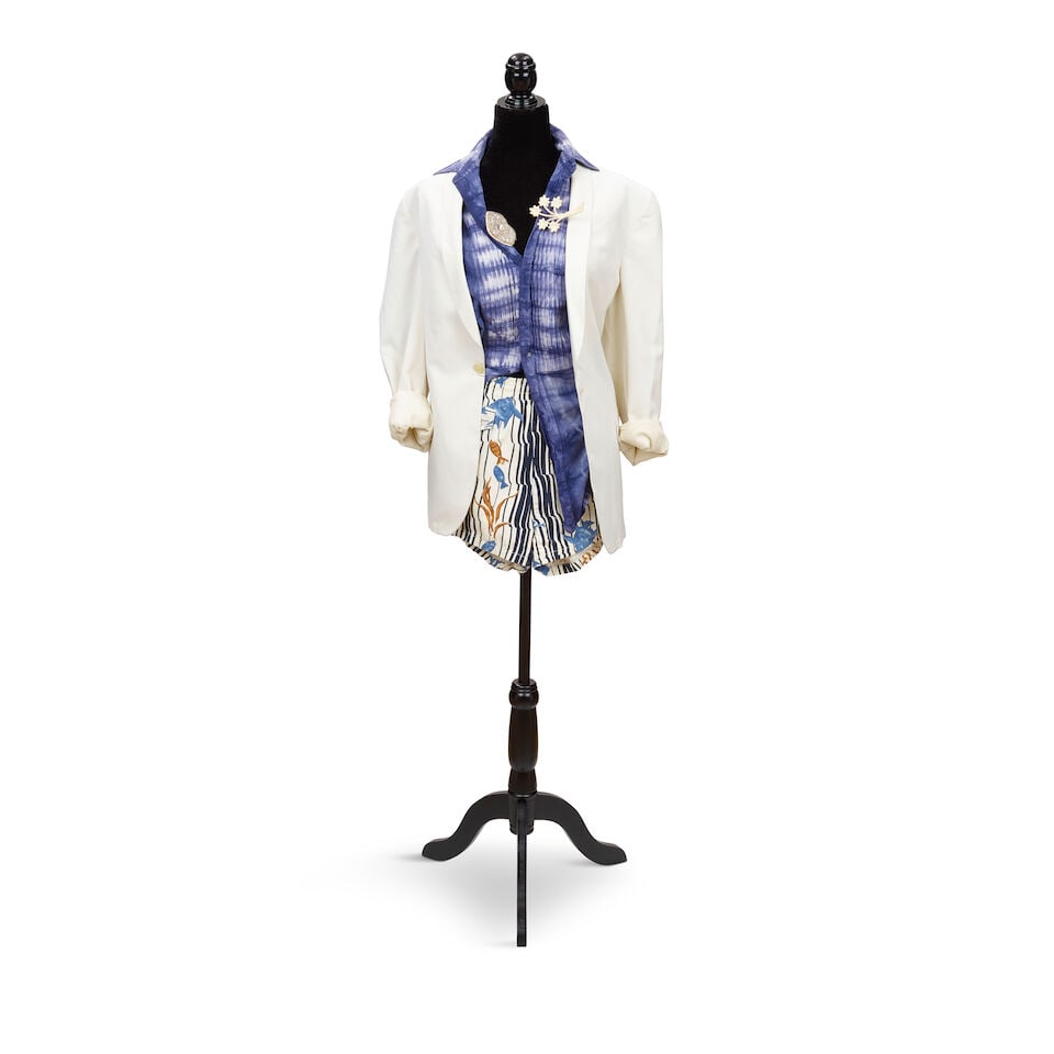 A PRESS TOUR-WORN PIN DECORATED WHITE BLAZER LOOK 1984/5: A PRESS TOUR-WORN PIN DECORATED WHITE BLAZER LOOK 1984/5 Comprising a white blazer, a Manhattan indigo tie-dye shirt, a pair of drawstring aquatic motif shorts, a white Bakelite flower bundle pin,