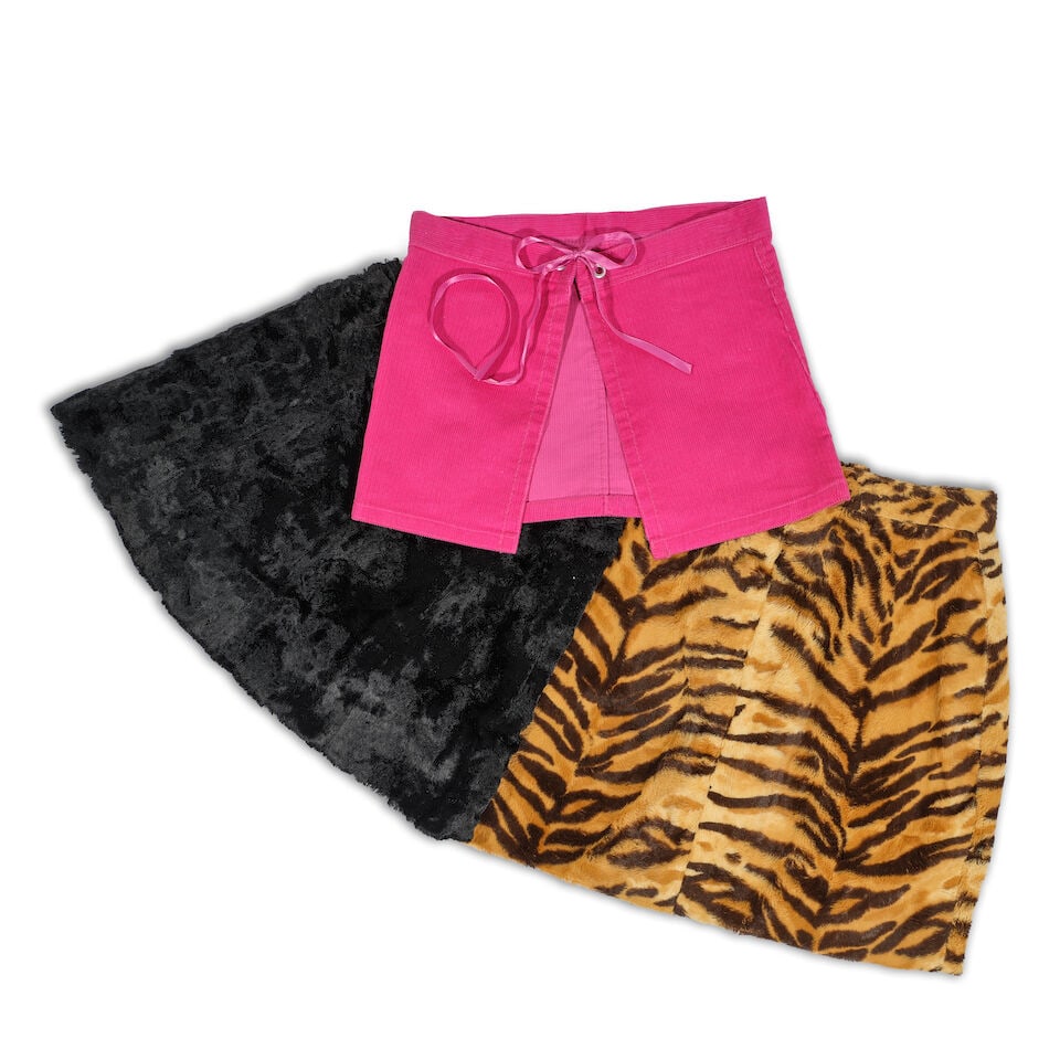 A GROUP OF CLOTHING AND ACCESSORIES 1980s: A GROUP OF CLOTHING AND ACCESSORIES 1980s Comprising Control-ette coral girdle, a forest green girdle, a Vanity Fair black girdle, large, a magenta bustier, a magenta corduroy open skirt, a red lace a