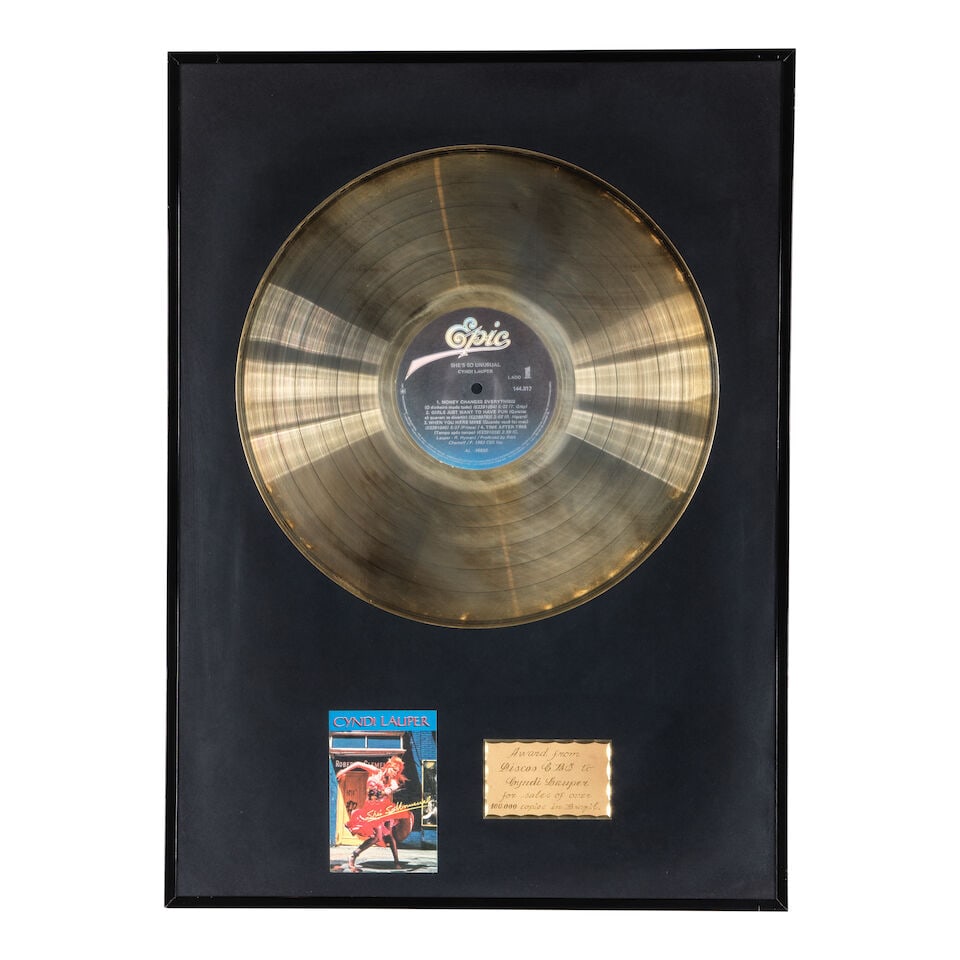 FIVE FRAMED BRAZILIAN GOLD AND PLATINUM AWARDS PRESENTED TO CYNDI LAUPER 1980s: FIVE FRAMED BRAZILIAN GOLD AND PLATINUM AWARDS PRESENTED TO CYNDI LAUPER 1980s Comprising a Discos CBS Gold Disc Award from for She's So Unusual, an Epic Records Platinum Disc Award, a Portrait Record