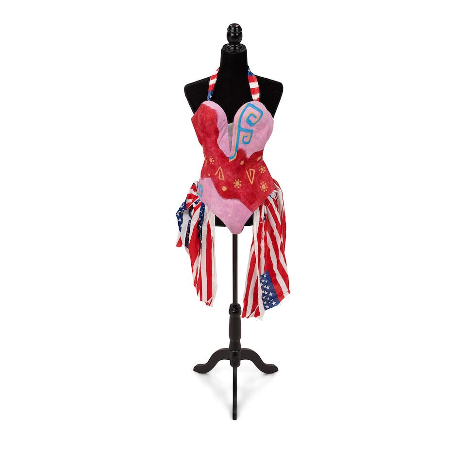 TWO PHOTOSHOOT LOOKS 1988: TWO PHOTOSHOOT LOOKS 1988 Comprising a custom painted red and pink strapless bathing suit with American flag tassels, and a purple bead embroidered netted bodice. (2) Footnotes: The bathing suit worn