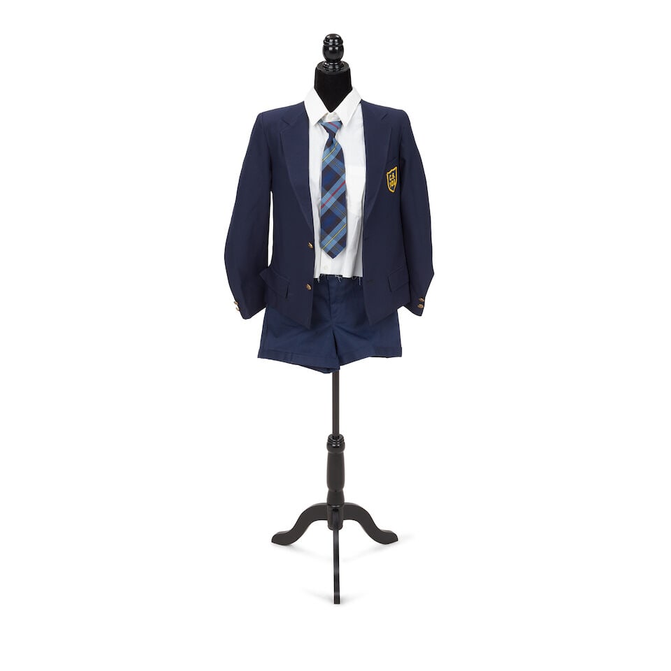 A STAGE-WORN NAVY TWO-PIECE SUIT FROM THE WALL 1990: A STAGE-WORN NAVY TWO-PIECE SUIT FROM THE WALL 1990 Comprising a navy Giovanni Bellini blazer with a patch, shoulders 15in, a distressed white-button down cut-off dress shirt, a blue plaid adjustable