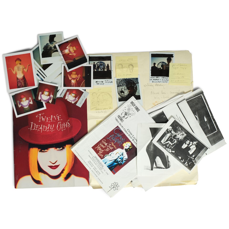 A GROUP OF PRODUCTION MATERIAL FROM THE 'HEY NOW (GIRLS JUST WANT TO HAVE FUN)' MUSIC VIDEO 1994: A GROUP OF PRODUCTION MATERIAL FROM THE 'HEY NOW (GIRLS JUST WANT TO HAVE FUN)' MUSIC VIDEO 1994 Comprising a storyboard in a file folder with affixed Polaroids and Post-It notes showing the