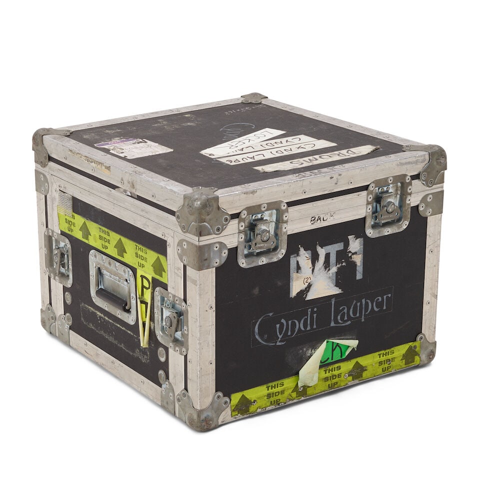 A TOUR-USED AVID M BOX PRO IN A CYNDI LAUPER STENCILED ROAD CASE: A TOUR-USED AVID M BOX PRO IN A CYNDI LAUPER STENCILED ROAD CASE The road case with various inscriptions, stickers, and labels. road case 16 1/2 x 21 1/2 x 22 1/2in This lot is subject to the