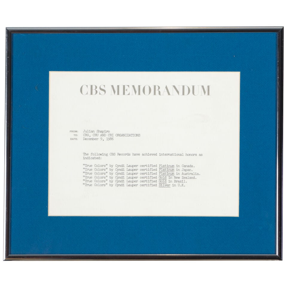 A GROUP OF EARLY CAREER MATERIAL 1980s: A GROUP OF EARLY CAREER MATERIAL 1980s Comprising a AMOA Rising Star on Jukeboxes Award plaque dated October 27, 1984, a framed CBS Five Day Hot Product List dated 3/16/84 including Cyndi Lauper's