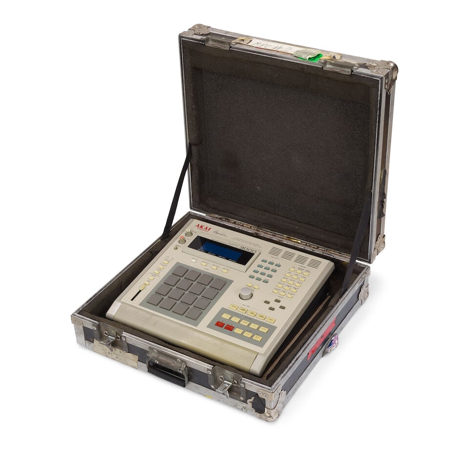 A TOUR-USED AKAI PROFESSIONAL MPC3000 INTEGRATED RHYTHM MACHINE IN A CYNDI LAUPER ROAD CASE Desi...: A TOUR-USED AKAI PROFESSIONAL MPC3000 INTEGRATED RHYTHM MACHINE IN A CYNDI LAUPER ROAD CASE Designed by Roger Linn, released 1994 16-bit drum sampler/midi sequencer, the road case with various