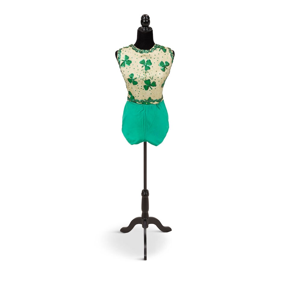 A GROUP OF HOLIDAY LOOKS 1990s: A GROUP OF HOLIDAY LOOKS 1990s Comprising a sequin embellished shamrock top, a pair of Saks Fifth Avenue green satin shorts, an Exelnt Designs faux fur trimmed red velveteen mini-dress, ML, a Chompol 
