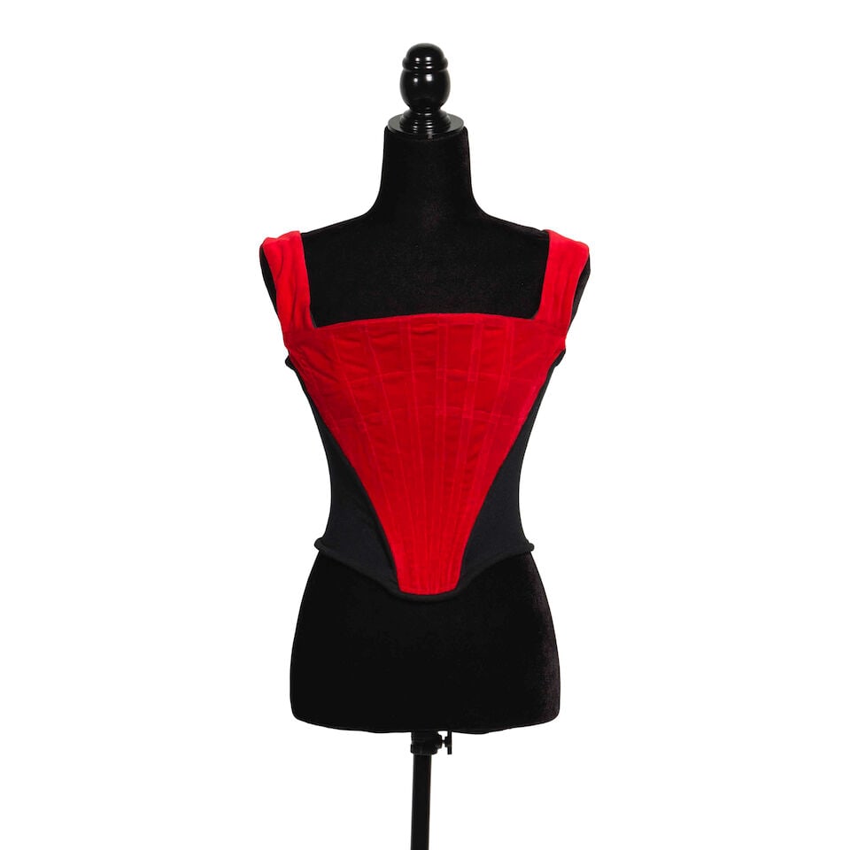 A VIVIENNE WESTWOOD 'ANGLOMANIA' RED VELVET AND BLACK CORSET Vivienne Westwood, 'Anglomania' Col...: A VIVIENNE WESTWOOD 'ANGLOMANIA' RED VELVET AND BLACK CORSET Vivienne Westwood, 'Anglomania' Collection, Fall/Winter 1993-94 UK 10. Footnotes: As indicated by the collection name, 'Anglomania' was ins