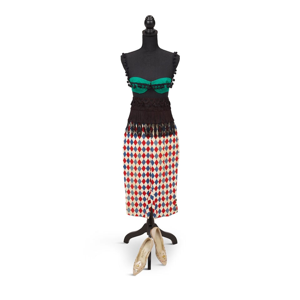 THE PARTIAL LOOK FROM THE A NIGHT TO REMEMBER ALBUM COVER 1989: THE PARTIAL LOOK FROM THE A NIGHT TO REMEMBER ALBUM COVER 1989 Comprising a pair of red and blue harlequin print capri pants, a vintage kelly green pom-pom tasseled strapless bikini top, a black