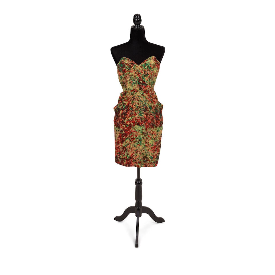 A GROUP OF PROMOTIONAL AND PRESS TOUR-WORN DRESSES 1989: A GROUP OF PROMOTIONAL AND PRESS TOUR-WORN DRESSES 1989 Comprising a Mademoiselle Juliette navy blue crochet dress, a rust tiered and pleated dress, a multicolor strapless dress, a blue, red, and