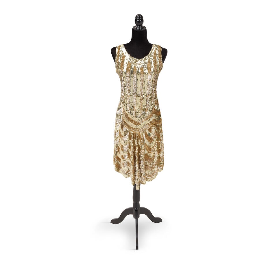 THE DRESS WORN ON THE COVER OF THE CHANGE OF HEART SINGLE 1986: THE DRESS WORN ON THE COVER OF THE CHANGE OF HEART SINGLE 1986 Embroidered with gold-toned sequins, together with a similar pair of gold-tone orb earrings. This lot is accompanied by a Change of