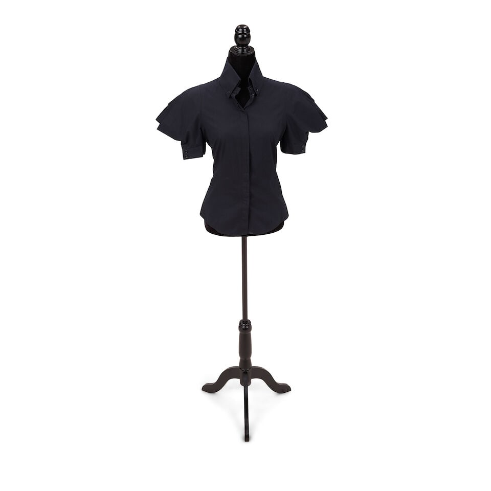 TWO ALEXANDER MCQUEEN SHORT SLEEVE BLOUSES Alexander McQueen/Sarah Burton, 2009/2010: TWO ALEXANDER MCQUEEN SHORT SLEEVE BLOUSES Alexander McQueen/Sarah Burton, 2009/2010 Comprising a black cotton blouse, 42, and a navy blue cotton blouse, no marked size. This lot is subject to the