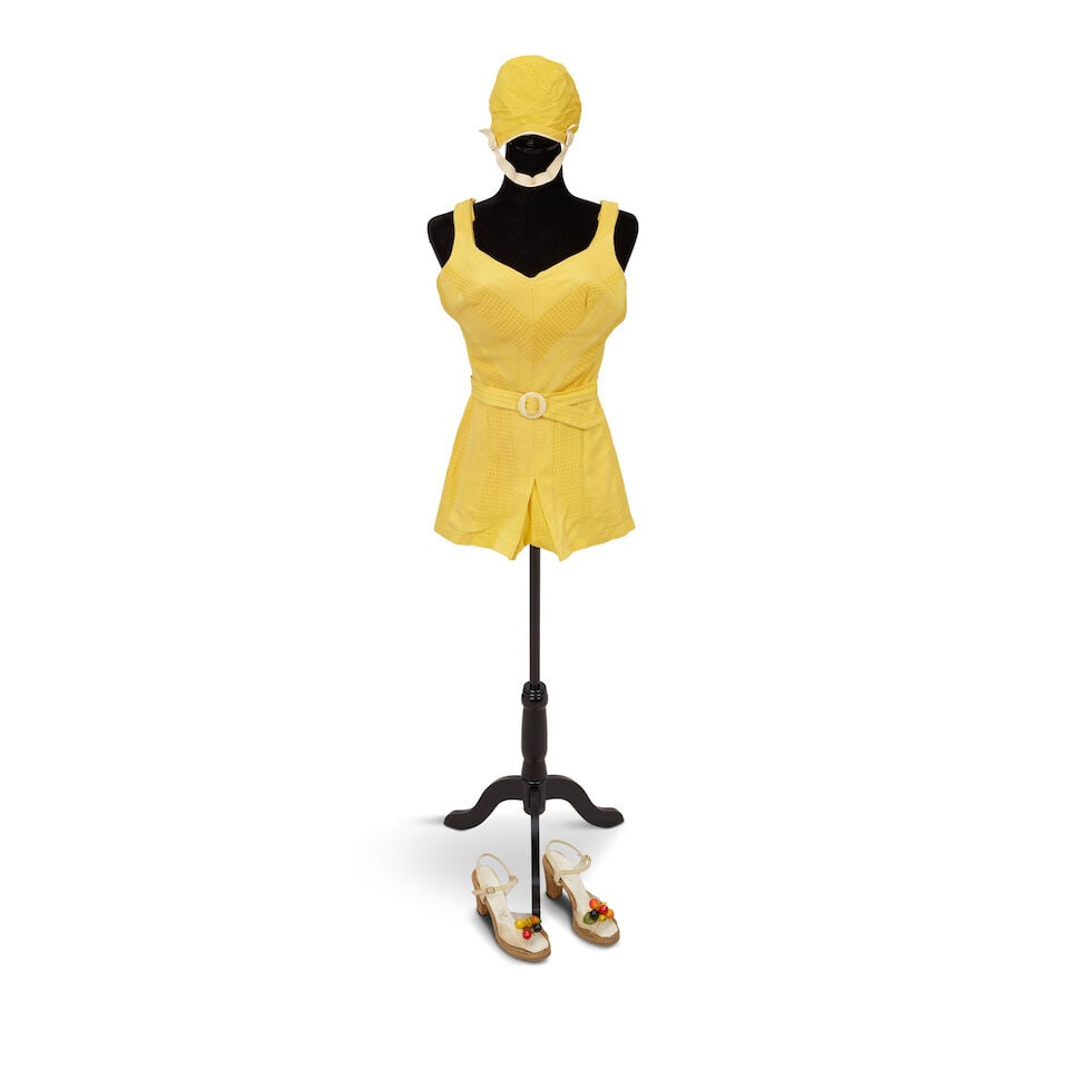 THE YELLOW BATHING COSTUME LOOK FROM THE SET YOUR HEART SINGLE COVER 2007: THE YELLOW BATHING COSTUME LOOK FROM THE SET YOUR HEART SINGLE COVER 2007 Comprising a vintage Jantzen yellow bathing costume, a yellow bathing cap, and a pair of fruit and acrylic heels.
