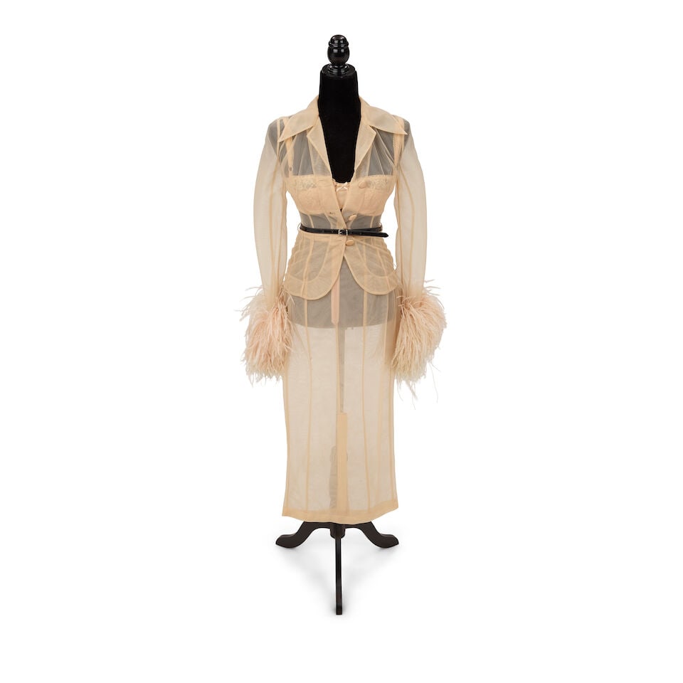 A STAGE-WORN DOLCE & GABBANA SHEER FEATHERED BLOUSE AND SKIRT SET Domenico Dolce and Stefano Gab...: A STAGE-WORN DOLCE & GABBANA SHEER FEATHERED BLOUSE AND SKIRT SET Domenico Dolce and Stefano Gabbana, Spring/Summer 1995 Comprising a blouse with feathered cuffs, a skirt, 40, and a lace and nylon