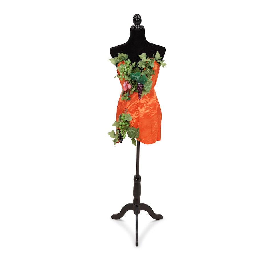 THREE FRUIT AND FLOWERS LOOKS Late 1980s/early 1990s: THREE FRUIT AND FLOWERS LOOKS Late 1980s/early 1990s Comprising an olive and black corset dress and grape and leaves hat, an orange strapless minidress with applied grape, leaf, and strawberry