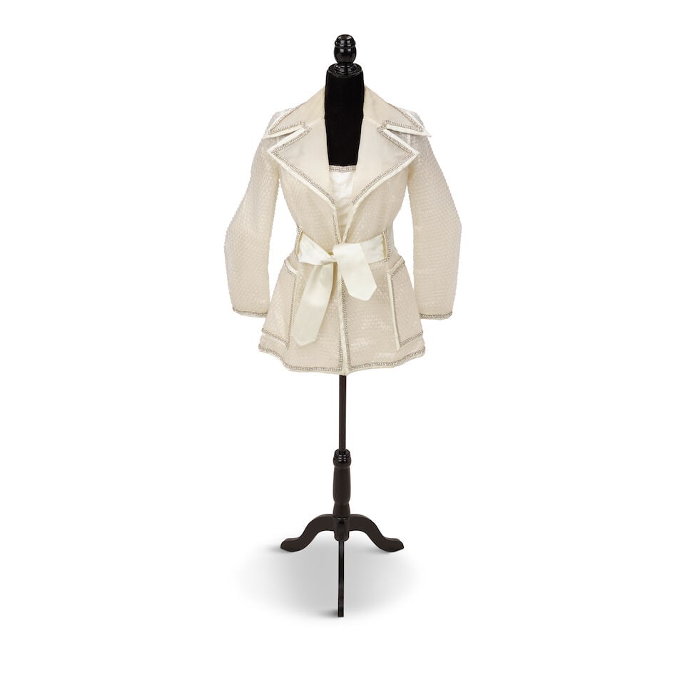 TWO CUSTOM WHITE GLAM LOOKS 1990s: TWO CUSTOM WHITE GLAM LOOKS 1990s First look: a rhinestone embellished bubble wrap trenchcoat and minidress; Second look: a white long ribbon skirt and a white fringe mop hat, together with a similar