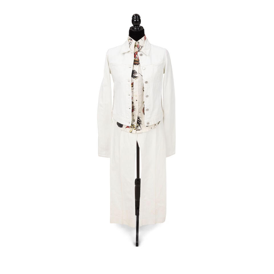 A GROUP OF PROMOTIONAL AND STAGE-WORN CLOTHING 2000s: A GROUP OF PROMOTIONAL AND STAGE-WORN CLOTHING 2000s Comprising a multicolor vest, a Gianfranco Ferre white ruffle blouse, 44, an Etro floral and paisley ruffle shirt, 44, a Griffin Melbourne