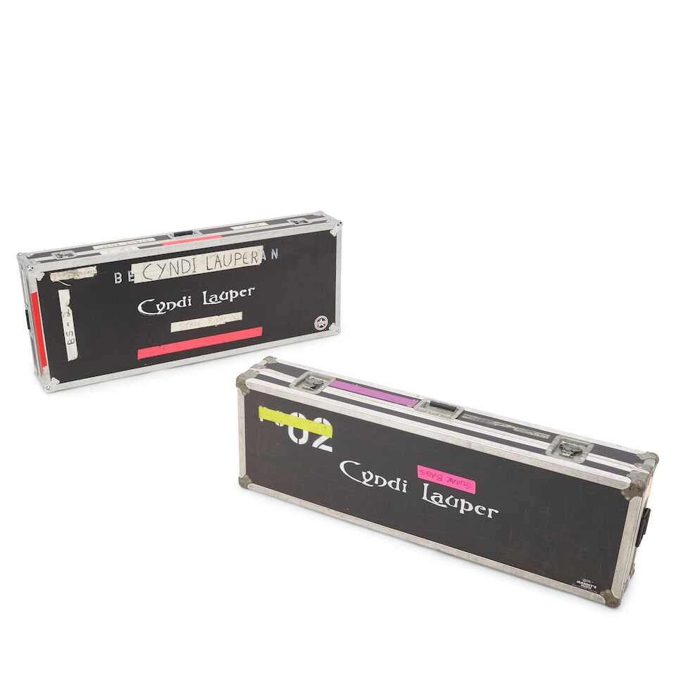 TWO TOUR-USED CYNDI LAUPER STENCILED KEYBOARD ROAD CASES: TWO TOUR-USED CYNDI LAUPER STENCILED KEYBOARD ROAD CASES Empty, with various inscriptions, stickers, and labels. both 9 1/2 x 63 1/2 x 25 1/2in This lot is subject to the following lot symbols: W