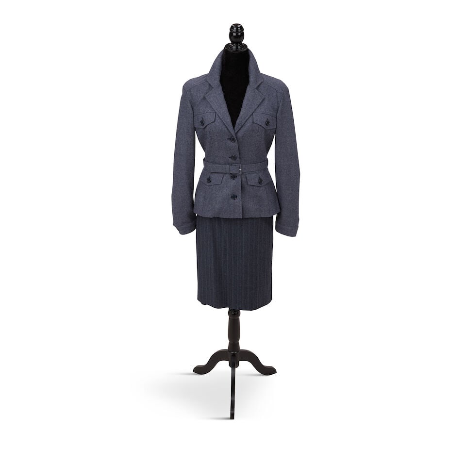 AN ALEXANDER MCQUEEN BLUE GREY SKIRT SUIT ENSEMBLE Alexander McQueen, 'The Man Who Knew Too Much...: AN ALEXANDER MCQUEEN BLUE GREY SKIRT SUIT ENSEMBLE Alexander McQueen, 'The Man Who Knew Too Much' Collection, Fall/Winter 2005 With a belt, both pieces wool, the skirt pin striped, the jacket 42, the