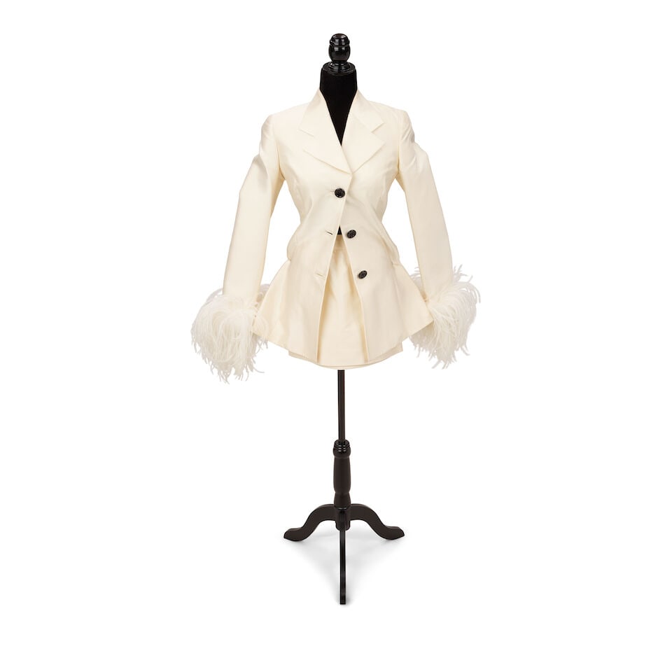 A DOLCE & GABBANA WHITE FEATHER TRIM MINISKIRT SUIT Domenico Dolce and Stefano Gabbana, Spring/S...: A DOLCE & GABBANA WHITE FEATHER TRIM MINISKIRT SUIT Domenico Dolce and Stefano Gabbana, Spring/Summer 1995 Together with a La Perla white silk robe and lace embellished negligee, 2 and 3, an ivory flo