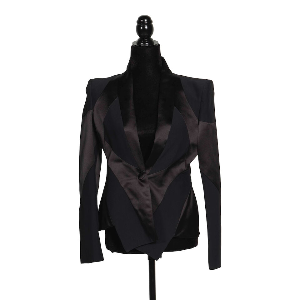 TWO ALEXANDER MCQUEEN BLACK SATIN TRIM JACKETS Alexander McQueen/Sarah Burton, 2009/2010: TWO ALEXANDER MCQUEEN BLACK SATIN TRIM JACKETS Alexander McQueen/Sarah Burton, 2009/2010 One an acetate blend and one a silk blend, both 44. Footnotes: The jacket with lapels worn on American Idol at